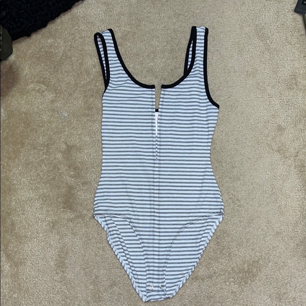 Black and white stripped body suit never worn